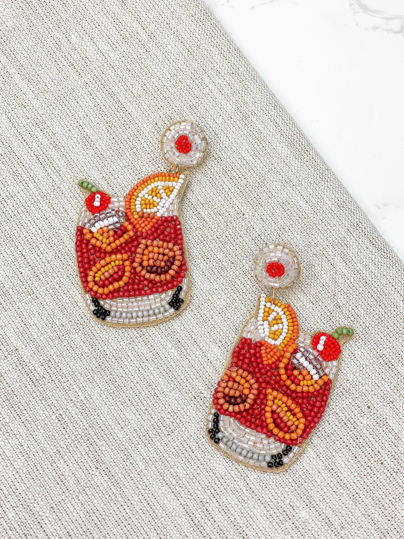 https://www.abigailfoxstore.com/cdn/shop/products/old-fashioned-cocktail-beaded-dangle-earrings-210203_1600x.jpg?v=1683056520